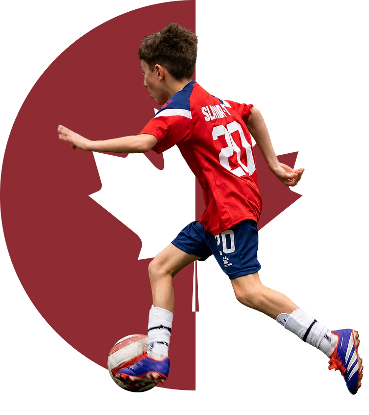Child playing soccer with Canadian flag background.